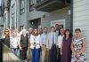 Staff from Northumberland County, the Northumberland County Housing Corporation, politicians including Ontario Minister of Housing and Infrastructure parliamentary secretary Jennifer McKelvie, Northumberland-Peterborough South MPP David Piccini and Northumberland County Warden Brian Ostrander, and private sector partners marked the completion of the Elgin Park affordable housing redevelopment project in Cobourg on July 24, 2025. (Photo: Northumberland County)