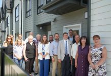 Staff from Northumberland County, the Northumberland County Housing Corporation, politicians including Ontario Minister of Housing and Infrastructure parliamentary secretary Jennifer McKelvie, Northumberland-Peterborough South MPP David Piccini and Northumberland County Warden Brian Ostrander, and private sector partners marked the completion of the Elgin Park affordable housing redevelopment project in Cobourg on July 24, 2025. (Photo: Northumberland County)