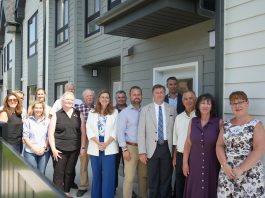 Staff from Northumberland County, the Northumberland County Housing Corporation, politicians including Ontario Minister of Housing and Infrastructure parliamentary secretary Jennifer McKelvie, Northumberland-Peterborough South MPP David Piccini and Northumberland County Warden Brian Ostrander, and private sector partners marked the completion of the Elgin Park affordable housing redevelopment project in Cobourg on July 24, 2025. (Photo: Northumberland County)
