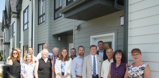Staff from Northumberland County, the Northumberland County Housing Corporation, politicians including Ontario Minister of Housing and Infrastructure parliamentary secretary Jennifer McKelvie, Northumberland-Peterborough South MPP David Piccini and Northumberland County Warden Brian Ostrander, and private sector partners marked the completion of the Elgin Park affordable housing redevelopment project in Cobourg on July 24, 2025. (Photo: Northumberland County)