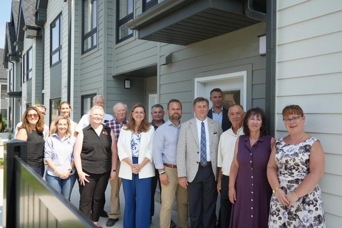 Staff from Northumberland County, the Northumberland County Housing Corporation, politicians including Ontario Minister of Housing and Infrastructure parliamentary secretary Jennifer McKelvie, Northumberland-Peterborough South MPP David Piccini and Northumberland County Warden Brian Ostrander, and private sector partners marked the completion of the Elgin Park affordable housing redevelopment project in Cobourg on July 24, 2025. (Photo: Northumberland County)