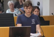 Auden Palmer, director of outreach services at One City Peterborough, addresses Peterborough city council on July 2, 2025 before councillors voted 6-5 against providing continued funding for expanded services at Trinity Centre in 2026 for people experiencing homelessness. (kawarthaNOW screenshot of City of Peterborough video)