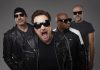 U2 tribute band Acrobat (Martin Chorlton as The Edge, Gabriel Pate as Bono, Mark Baker as Adam Clayton, and Michael Wood as Larry Mullen Jr.) performs a free-admission concert at Peterborough Musicfest in Del Crary Park on August 2, 2025. (Publicity photo)