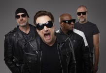 U2 tribute band Acrobat (Martin Chorlton as The Edge, Gabriel Pate as Bono, Mark Baker as Adam Clayton, and Michael Wood as Larry Mullen Jr.) performs a free-admission concert at Peterborough Musicfest in Del Crary Park on August 2, 2025. (Publicity photo)