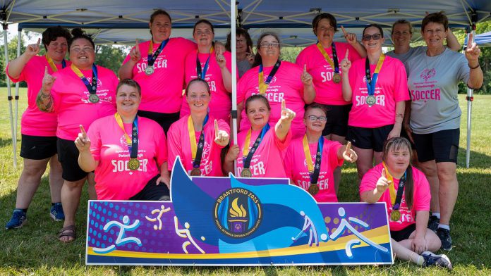 The Peterborough Special Olympic women's soccer team (Candace Bushie, Crystal Cochrane, Jasmine Davis, Haley Fowler, Heather Fowler, Nicole Hewitt, Kristen Lackey, Gillian McHugh, Miriam McHugh, Kacee Quinlan, Jenn Wildman, and Carlea Wilkie-Ellis) with coaches Debbie Quinlan, Shawna Goode, and Linda Wilkie celebrating the first-ever gold medal in the women's soccer division at the Special Olympics provincial games, held in Brantford from July 10 to 13, 2025. (Photo: Special Olympics Ontario) The Peterborough Special Olympic women's soccer team (Candace Bushie, Crystal Cochrane, Jasmine Davis, Haley Fowler, Heather Fowler, Nicole Hewitt, Kristen Lackey, Gillian McHugh, Miriam McHugh, Kacee Quinlan, Jenn Wildman, and Carlea Wilkie-Ellis) with coaches Debbie Quinlan, Shawna Goode, and Linda Wilkie celebrating the first-ever gold medal in the women's soccer division at the Special Olympics provincial games, held in Brantford from July 10 to 13, 2025. (Photo: Special Olympics Ontario)