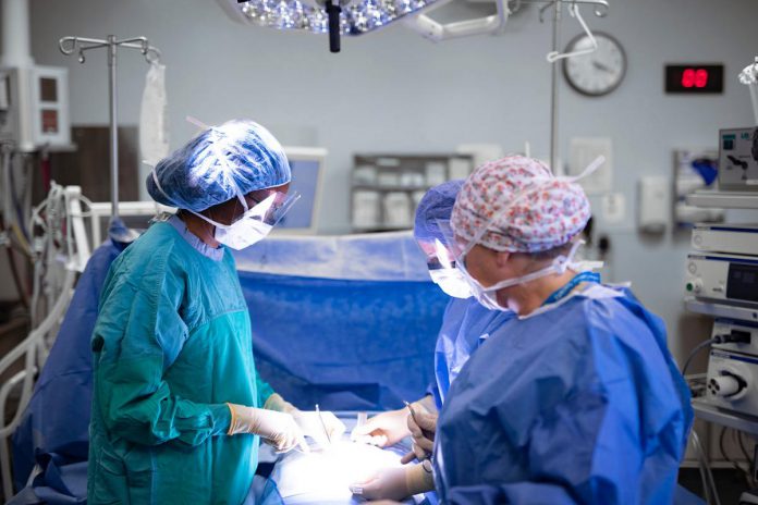 Vascular surgeon Dr. Heather Cox (left), deputy chief of surgery at Peterborough Regional Health Centre (PRHC), and surgical nurses Kendra Kinsey and Debbie Kennedy in one of the hospital's two dedicated operating rooms for vascular surgery. Minimally invasive intervention, including a hybrid operating room where multiple operations can be performed on the same patient on the same day and in the same room, is one of the priority areas of care in the PRHC Foundation's Campaign for PRHC because it's critically important for PRHC patients who need complex, time-sensitive, life and limb-saving care. (Photo courtesy of PRHC Foundation)