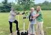 Selwyn Township mayor Sherry Senis, Peterborough County warden Bonnie Clark, and Hydro One communications and marketing vice president and Bronwen Evans planting a tree at Paul J. English Chemung Lions Park in Bridgenorth on June 16, 2025 when Hydro One announced that Selwyn Township is one of 50 municipalities and Indigenous communities in Ontario that would receive up to $10,000 to assist in recovery efforts from March's devastating ice storm. (Photo: Hydro One)