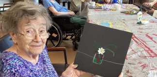 Mary, a resident of Victoria Manor in Lindsay, displays an artwork she created as part of the new "Seniors for Seniors" art program offered by Kawartha Art Gallery with support from the City of Kawartha Lakes. (Photo: Kawartha Art Gallery)