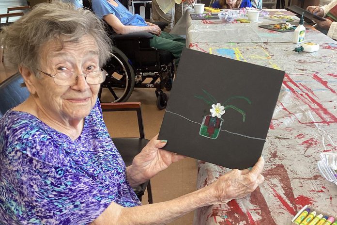 Mary, a resident of Victoria Manor in Lindsay, displays an artwork she created as part of the new "Seniors for Seniors" art program offered by Kawartha Art Gallery with support from the City of Kawartha Lakes. (Photo: Kawartha Art Gallery) Mary, a resident of Victoria Manor in Lindsay, displays an artwork she created as part of the new "Seniors for Seniors" art program offered by Kawartha Art Gallery with support from the City of Kawartha Lakes. (Photo: Kawartha Art Gallery)