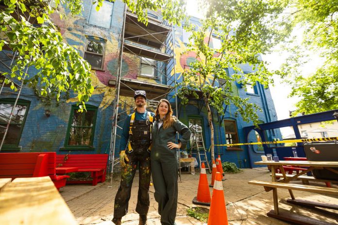 To restore the iconic sunflower mural at The Only Café in downtown Peterborough, originally painted by Jeremy Moore more than 25 years ago, brother-and-sister team Zephyr and Trinity Bugelli had to scrape off the old paint that was left on the walls before blocking off the colours. It took them two weeks to restore the mural to its original vibrancy. (Photo: Zach Ward)