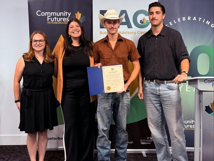Summer Company program graduate Spencer Toth of Farm Hands in Cavan-Monaghan Township (holding certificate) with, from left to right, Business Advisory Centre entrepreneurship officer Allison Adam, Business Advisory Centre manager Rose Terry, and Joel Porter from the constituency office of Peterborough-Kawartha MPP Dave Smith at a celebratory event on August 13, 2025 at Venture North in downtown Peterborough. (Photo courtesy of Community Futures Peterborough)