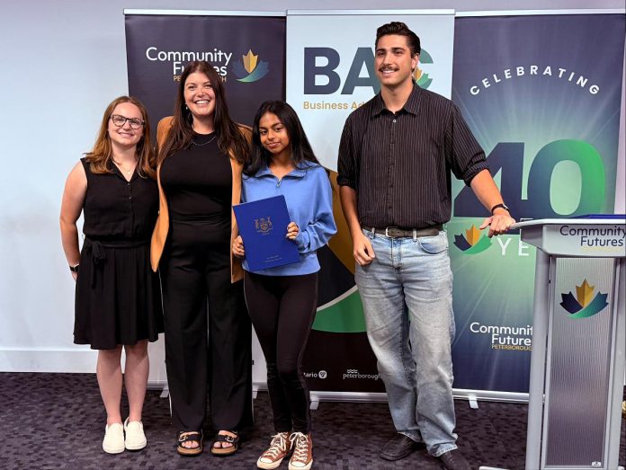 Summer Company program graduate Neha Mervin of Sparks of Bollywood in Otonabee-South Monaghan Township (holding certificate) with, from left to right, Business Advisory Centre entrepreneurship officer Allison Adam, Business Advisory Centre manager Rose Terry, and Joel Porter from the constituency office of Peterborough-Kawartha MPP Dave Smith at a celebratory event on August 13, 2025 at Venture North in downtown Peterborough. (Photo courtesy of Community Futures Peterborough)