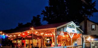 At their seasonal Keene barbeque joint Muddy's Pit BBQ, Neil and Julie Lorenzen have supported the local economy for 16 years by sourcing locally grown meats, vegetables, and beverages, and by inviting local musicians to perform during their weekly live music series. In return, several local businesses support Muddy's by selling their homemade barbeque sauce. (Photo courtesy of Muddy's Pit BBQ)