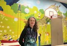 The giant mural created by artist Sharon Pearsall at Five Counties Children's Centre in Peterborough has left a lasting impression for children and families. Completed in 1981 when Sharon was finishing high school, the 25-foot wide by 13-foot high mural has stood the test of time over 44 years, putting smiles on those who see it. (Photo: Five Counties Children's Centre)