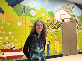 The giant mural created by artist Sharon Pearsall at Five Counties Children's Centre in Peterborough has left a lasting impression for children and families. Completed in 1981 when Sharon was finishing high school, the 25-foot wide by 13-foot high mural has stood the test of time over 44 years, putting smiles on those who see it. (Photo: Five Counties Children's Centre)