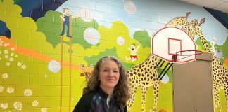 The giant mural created by artist Sharon Pearsall at Five Counties Children's Centre in Peterborough has left a lasting impression for children and families. Completed in 1981 when Sharon was finishing high school, the 25-foot wide by 13-foot high mural has stood the test of time over 44 years, putting smiles on those who see it. (Photo: Five Counties Children's Centre)