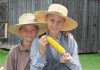There will be plenty of cooked corn smothered in butter for the entire family to enjoy during the annual Corn Roast event at Lang Pioneer Village Museum in Keene on August 17, 2025. Find out the many ways 19th-century settlers used corn, watch a variety of harvest-related and historic demonstrations, enter a corn-on-the-cob eating contest, and more. (Photo courtesy of Lang Pioneer Village Museum)