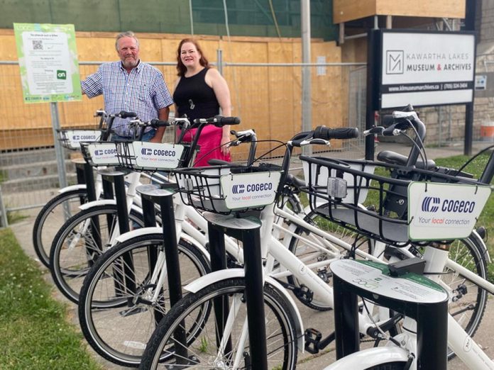 Lindsay and District Chamber of Commerce executive director Terry Guiel with Kawartha Lakes Museum & Archives managing director Barbara Doyle when launching the chamber's bike share location at the museum in 2024. The location was the third to be launched in the program, following the debut locations behind the chamber office and at Fleming College's Frost Campus in 2023. (Photo courtesy of Lindsay and District Chamber of Commerce)