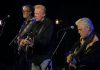 The Russell DeCarle Trio, featuring Prairie Oyster frontman Russell DeCarle with Steve Briggs on guitar and Russ Boswell on bass, is performing at the Dominion Hotel in Minden on Saturday night. (kawarthaNOW screenshot of YouTube video)