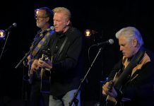 The Russell DeCarle Trio, featuring Prairie Oyster frontman Russell DeCarle with Steve Briggs on guitar and Russ Boswell on bass, is performing at the Dominion Hotel in Minden on Saturday night. (kawarthaNOW screenshot of YouTube video)