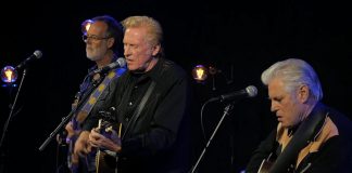 The Russell DeCarle Trio, featuring Prairie Oyster frontman Russell DeCarle with Steve Briggs on guitar and Russ Boswell on bass, is performing at the Dominion Hotel in Minden on Saturday night. (kawarthaNOW screenshot of YouTube video)