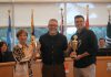 Northumberland County recently announced the winners of its 15th annual Keep the County Clean Challenge. The Town of Cobourg earned the trophy for highest proportional representation of volunteers, with five per cent of its population taking part in this year's challenge, and Cramahe Township took home the trophy for hardest-working volunteers, with each volunteer collecting an average of 15.8 kg of litter. Pictured during a Northumberland County council meeting on August 13, 2025 are Cramahe Township Mayor Mandy Martin, Northumberland County education and communications coordinator Dan Orr, and Town of Cobourg Mayor Lucas Cleveland. (Photo: Northumberland County)