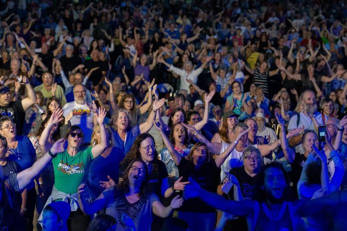 After leading the Peterborough Musicfest audience in an epic sing-along of hits from the 1980s on August 14, 2024, Daveed Goldman and Nobu Adilman of Choir! Choir! Choir! are returning to Del Crary Park on August 13, 2025 to do the same with the hits of Queen in a free-admission sing-along concert. (Photo: Peterborough Musicfest / Facebook)