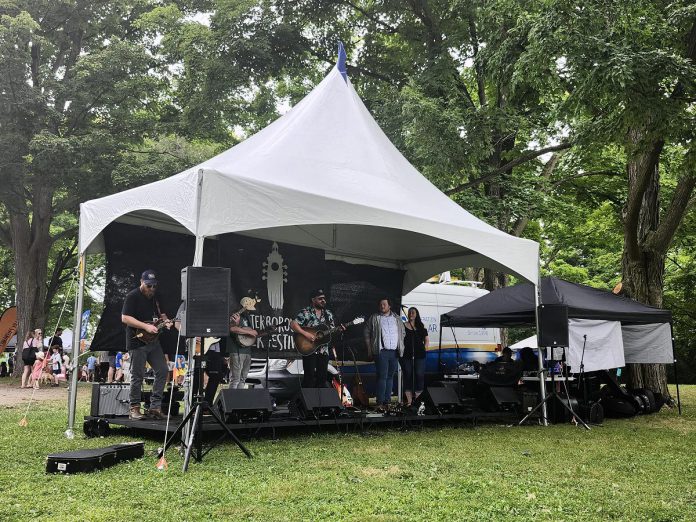 Folk festival aficionados will enjoy the Generation Solar Stage, located under the trees near the Artisan Village and Children's Village, for its artist collaborations and workshops involving two or three different artists. Sometimes these workshops become songwriters' circles with artists backing each other up, and other times they become multi-artist jam sessions.  (Photo courtesy of Peterborough Folk Festival)