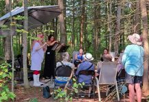 For the second year in a row, the Peterborough Symphony Orchestra is partnering with the Peterborough Field Naturalists to combine music and nature at Tecasy Ranch in Trent Hills in Peterborough County. On September 6, 2025, field guides will walk participants through an easy forested trail walk that will be interspersed with ensembles of music performances. Pictured are Jaye Marsh on flute and Jennifer Burford on violin during the inaugural event in 2024. (Photo courtesy of Peterborough Symphony Orchestra)