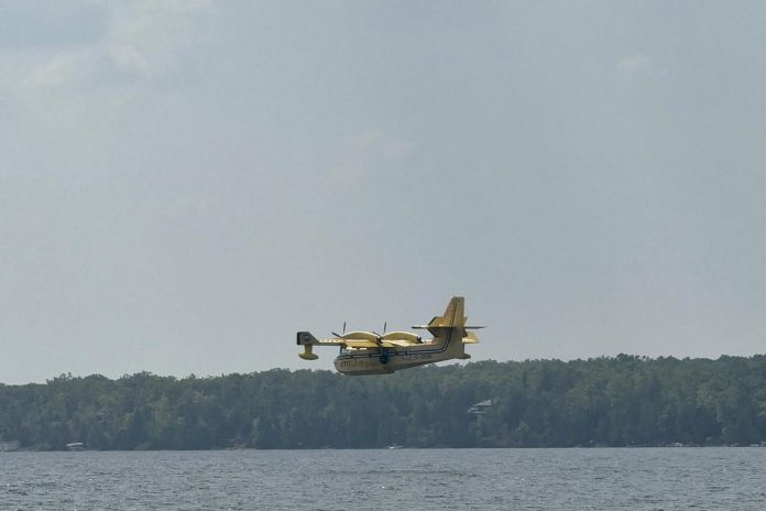 A water bomber collecting water on 4 Mile Lake on August 10, 2025 to fight a 27-hectare forest fire just east of Burnt River in Kawartha Lakes. (Photo: Patrick Porzuczek / Facebook)