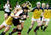 A group of young women playing rugby, with one woman being tackled. (Photo: Harry H Brewster vis Pexels)