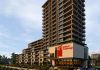 A rendering of Ashburnham Realty's proposed 17-storey apartment building to be located on Crescent Street in Peterborough, from EcoVue Consulting's notice of an open house about the proposed development to be held on September 23, 2025. The rendering includes what the notice describes as "the potential new location of the Art Gallery of Peterborough." (Graphic via EcoVue Consulting)