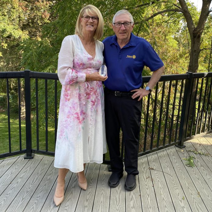 During the Rotary Club of Peterborough changeover meeting in June 2025, then-outgoing president Ken Seim presented past president Betty Halman-Plumley with the Rotarian of the Year award for her dedication and leadership. Alongside other contributions, the award was presented for her commitment to leading a community assessment that helped identify the Club's next legacy project: the Rotary Accessible Playground to be created at Riverside Park and Zoo. (Photo courtesy of Rotary Club of Peterborough)