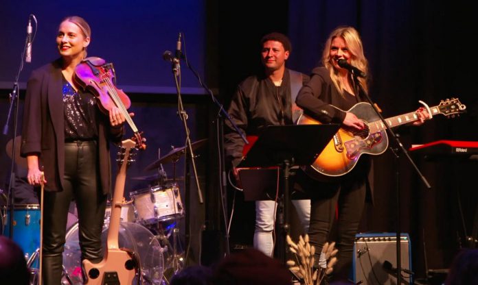 Melissa Payne and Kate Suhr are among the performers who will be returning to the stage during the annual Cancer Takedown fundraiser in Lindsay and Peterborough on November 4 and 5, 2025. Raising spirits and funds for cancer care at Peterborough Regional Health Centre, both evenings will feature live music and stories from three women who were diagnosed with cancer before the age of 40. (Photo courtesy of Amy Kemp)