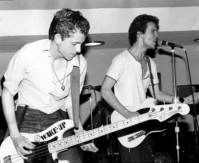 A 21-year-old Charlie Angus (left) circa 1983 playing bass with Andrew Cash in the politically oriented punk rock band L'Étranger. (Photo: Luis Marmelo)