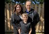 Kelly and Tony Doyle share a moment with their youngest child, 11-year-old Max, who received life-changing treatment at Five Counties Children's Centre as a baby. (Photo courtesy of Five Counties Children's Centre)