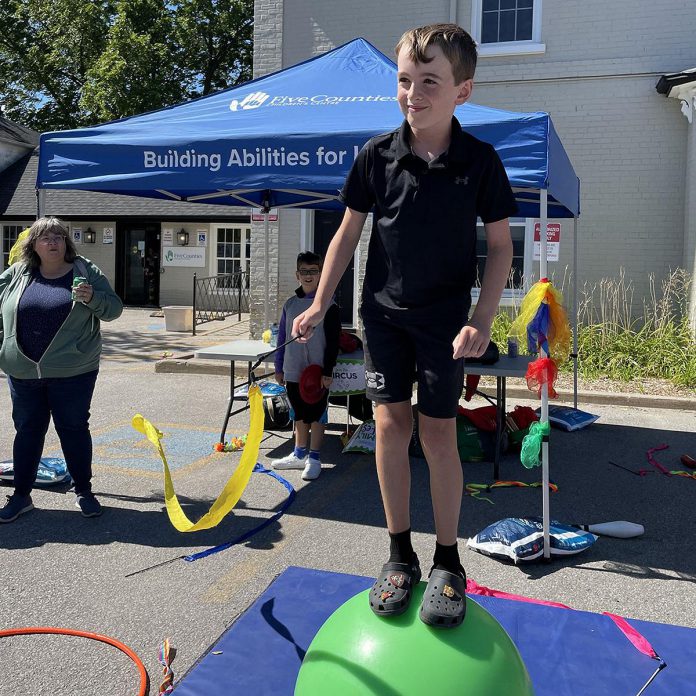 Max takes in some of the fun and activities held as part of a 50th birthday bash held in Lindsay by Five Counties to mark five decades of the Centre providing care to kids and youth in the region. (Photo courtesy of Five Counties Children's Centre)