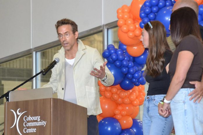 Actor Ryan Reynolds speaks about Grace Bowen during an official arena renaming ceremony on September 14, 2025 at the Cobourg Community Centre as Grace's family looks on. In April, Reynolds appeared before a committee of Cobourg council on behalf of the Bowen family to request the Pond Arena be renamed as the Grace Bowen Arena in memory of the nine-year-old Grafton hockey player who passed away from an aggressive form of bone cancer in 2015. (Photo: Natalie Hamilton / kawarthaNOW)