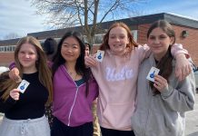 Students from Queen Mary Public School show off their transit passes for Grade 8 Transit Quest, a transit encouragement campaign organized by Active School Travel Peterborough. Transit ridership in youth is important for building life skills, accessing extracurricular opportunities, and fostering independence. (Photo: Natalie Stephenson / GreenUP)