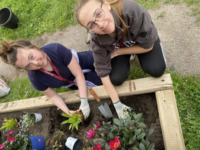 Making an impact locally was top of mind for members of the Youth Climate Action Leadership Series. When given the opportunity to decide where to allocate some grant funding, the teens chose to build gardens at the YES Shelter for Youth and Families in June 2025. (Photo: Natalie Stephenson / GreenUP)