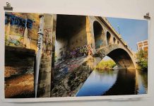 A one-of-a-kind massive print of the Hunter Street Bridge, which connects Peterborough's downtown to East City, is one of several items up in the "Keys To Hope" fundraising auction. Proceeds from the auction will support the Habitat for Humanity Peterborough & Kawarthas Region build in collaboration with Our Daughters' Home that will provide a safe, permanent home for seven women living with developmental disabilities on Sophia Street in East City. Open to community members to donate items as well as to bid, the online auction is running now until midnight on October 10, 2025. (Photo courtesy of Ashley Bonner)