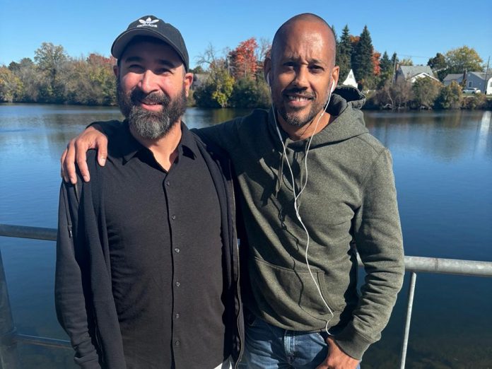 In 2024, for the second consecutive year, Michael Stringer (left) was the winner of the Oldies 96.7 $10,000 Fugitive Contest. After six weeks of searching, he cracked the clues and located and identified Fugitive Mike Dunkley (right) along the Otonabee River behind the Holiday Inn on George Street. (Photo courtesy of Oldies 96.7 / My Broadcasting Corporation)