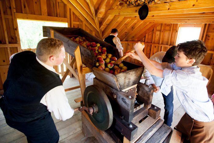 During Applefest at Lang Pioneer Village Museum in Keene on October 5, 2025, there will be many historic demonstrations including cider pressing at the Cider Mill, as well as live entertainment, games and crafts, apples and apple products to purchase, and more. (Photo: Lang Pioneer Village Museum)