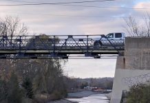 A pickup truck crosses the single-lane bridge on McFarlane Street via Ashburnham Drive on October 31, 2020. (Photo: Bruce Head / kawarthaNOW)