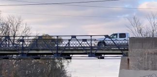 A pickup truck crosses the single-lane bridge on McFarlane Street via Ashburnham Drive on October 31, 2020. (Photo: Bruce Head / kawarthaNOW)