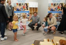 A young girl gives Northumberland County Warden Brian Ostrander a high five during an event at the new Canton YMCA Child Care Centre in Port Hope on September 4, 2025 to mark an an expansion initiative to increase child care in the high-needs areas of Port Hope, Trent Hills, and Cobourg, which resulted in the creation of four new child care centres and 181 new spaces. (Photo: Northumberland County)