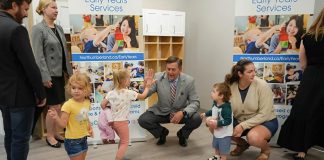 A young girl gives Northumberland County Warden Brian Ostrander a high five during an event at the new Canton YMCA Child Care Centre in Port Hope on September 4, 2025 to mark an an expansion initiative to increase child care in the high-needs areas of Port Hope, Trent Hills, and Cobourg, which resulted in the creation of four new child care centres and 181 new spaces. (Photo: Northumberland County)
