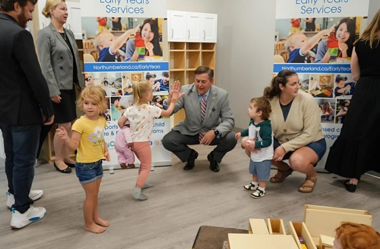 A young girl gives Northumberland County Warden Brian Ostrander a high five during an event at the new Canton YMCA Child Care Centre in Port Hope on September 4, 2025 to mark an an expansion initiative to increase child care in the high-needs areas of Port Hope, Trent Hills, and Cobourg, which resulted in the creation of four new child care centres and 181 new spaces. (Photo: Northumberland County)