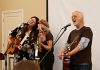 Terra Lightfoot and Melissa Payne join Blue Rodeo's Greg Keelor during a performance at "Raise a Little Shell" at the Ontario Turtle Conservation Centre (OTCC) on September 4, 2025. Emceed by Greg's wife Caolaidhe, a volunteer at OTCC who helped organize the event with the aim of raising awareness of the plight of Ontario's eight native turtle species and the work of the OTCC, the event also included a presentation from OTTC education coordinator Lisa Browning and from Ontario Nature's conservation policy and campaigns director Tony Morris. (Photo: Jordan Lyall Photography for kawarthaNOW)