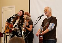 Terra Lightfoot and Melissa Payne join Blue Rodeo's Greg Keelor during a performance at "Raise a Little Shell" at the Ontario Turtle Conservation Centre (OTCC) on September 4, 2025. Emceed by Greg's wife Caolaidhe, a volunteer at OTCC who helped organize the event with the aim of raising awareness of the plight of Ontario's eight native turtle species and the work of the OTCC, the event also included a presentation from OTTC education coordinator Lisa Browning and from Ontario Nature's conservation policy and campaigns director Tony Morris. (Photo: Jordan Lyall Photography for kawarthaNOW)